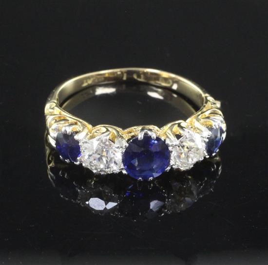 An early 20th century gold and platinum, sapphire and diamond five stone half hoop ring, size L.